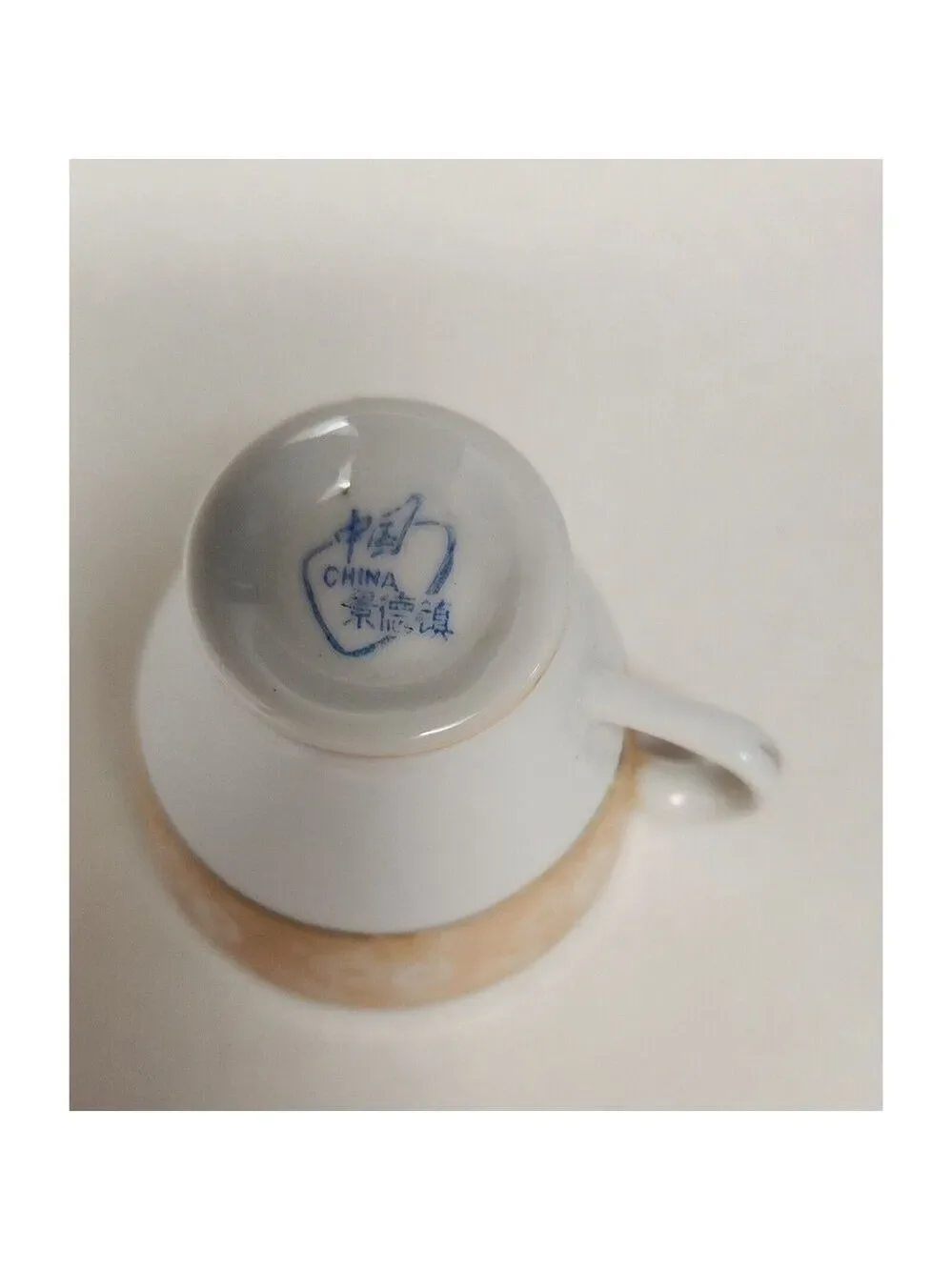 FOOTED MINITURE TEACUP AND SAUCER SET YELLOW W/ GOLD TRIM